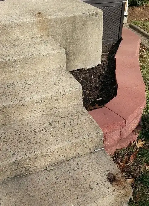 image of holes in stoop and sidewalk