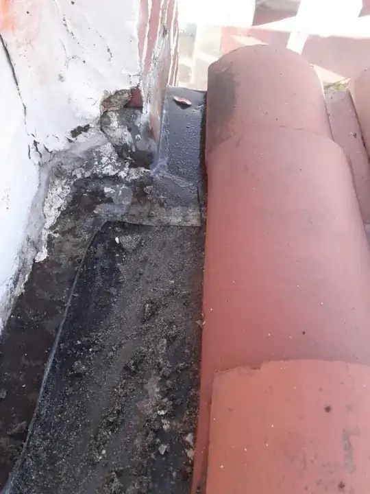 rusty 1938 tile roof stucco wall flashing