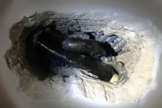 burned wall showing wires