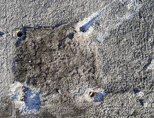 Concrete damage from mail post anchor being ripped out by DUI driver.