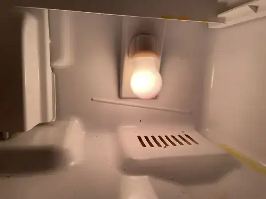 Vent at the bottom of the fridge behind the veggie drawer