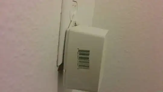 generic DC adapter plugged into electrical socket.