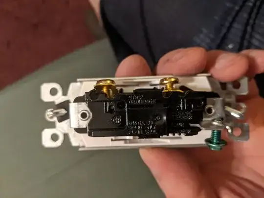 Side-mount screw hole shown with gray, plastic cover in place.