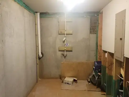 Back wall, bottom left of drawing