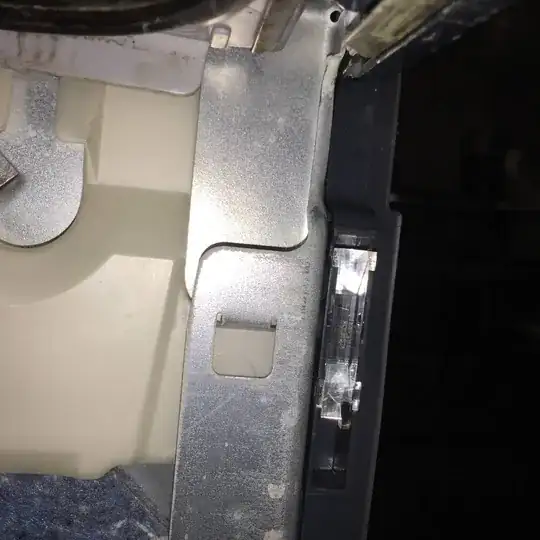 Untreated chipboard at side of shelf.