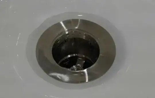 water around tub drain flange
