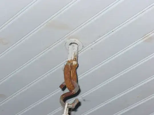 "A two-part compression coupler, with a 1.5 inch diameter and threads on the hub.  A nylon nut that threads on and secures the pipe."