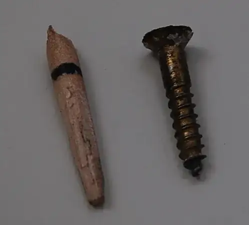 Dowel tapered to fill old screw hole