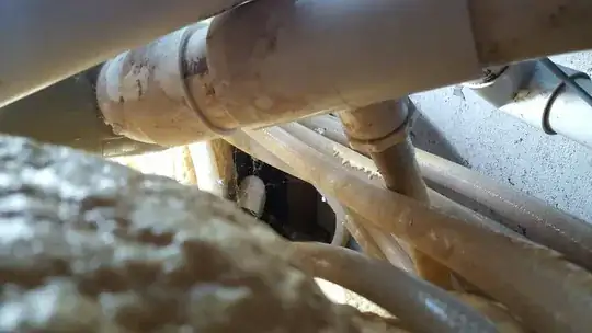 popping out the screw cover to reveal an inset-hex-head bolt