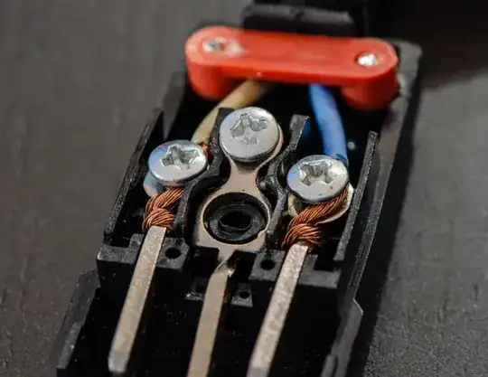 Stranded wires are loosely twisted around the connectors of the plug, the screws being relatively useless