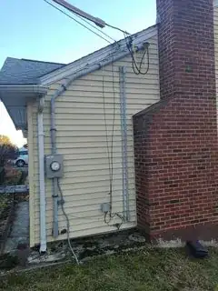 End of house with electrical and conduit connections