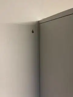 hole in drywall where screw was mounted