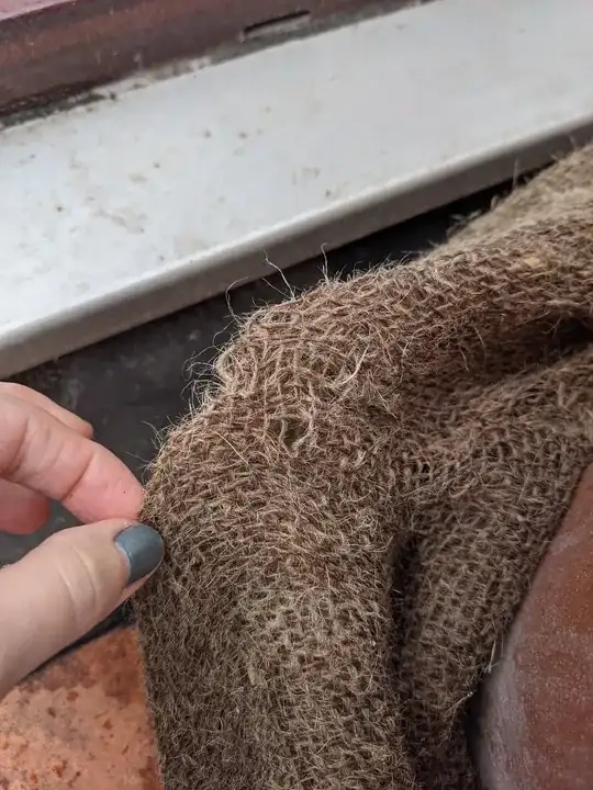 Close-up of squirrel damage to the hessian blanket - they really love/hate this one