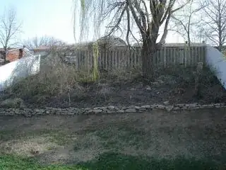 Back garden slope cleared for grass seeding