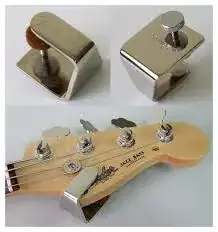 Metal sustainer clamp on a bass guitar