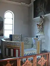 Baptismal  font on collateral aisle, mosaics by the Genevieve and Henri Taiffert (20th c.)