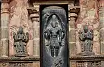 Shiva flanked by Brahma (left) and Vishnu