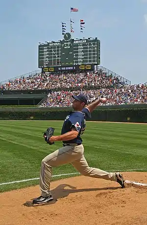 Image 8Chris Young winding up for a four-seam fastball in the bullpen while warming up before a 2007 game. Behind Young can be seen the Wrigley Field scoreboard and bleachers. Image credit: TonyTheTiger (photographer) and Jjron (editing) (from Portal:Illinois/Selected picture)