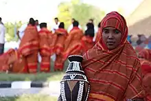 Image 46A Somali woman showing a decorated pottery (from Culture of Somalia)