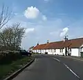 A row of white-washed cottages at Kingston