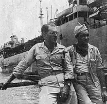 A Navy tanker delivers fuel. Master Sergeant Gerino Terenzi (right) is the section foreman, constantly checking his pumping stations and storage tanks.