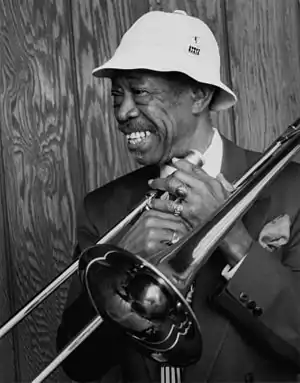 Image 4Al GreyPhotograph credit: William P. Gottlieb; restored by Adam CuerdenAl Grey (June&nbsp;6, 1925&nbsp;– March&nbsp;24, 2000) was an American jazz trombonist who was known for his plunger-mute technique. After serving in World War&nbsp;II, he joined Benny Carter's band, then the bands of Jimmie Lunceford, Lucky Millinder, and Lionel Hampton. In the 1950s, he was a member of the big bands of Dizzy Gillespie and Count Basie before forming his own bands in the 1960s. This photograph by William P. Gottlieb shows Grey still performing into the 1980s.More selected portraits