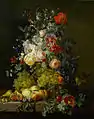 Still life with fruit and flowers on a ledge