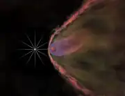 Depiction of the same pulsar one million times closer showing the effect of its wind on its companion star, which is evaporating.  The bow shock is too large to be shown, and at this scale would extend more than 15 miles (24&nbsp;km) beyond the edge of the computer screen.