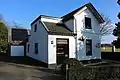 Former railway crossing guard house