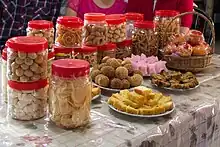 Image 74Aside from mandarin orange, various other snacks are presented for visitors throughout the Chinese New Year. (from Malaysian Chinese)