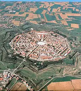 Image 11Palmanova, Italy, constructed in 1593 according to the defensive ideal of the star fort, today retains its distinctive geometry. (from History of cities)