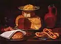 Still life with a similar position of the dish, the butter curls on top of the cheese
