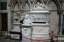 Three monuments of varying sizes and shapes, cordoned off by a red rope.