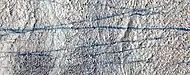 Close color view of dust devil tracks, as seen by HiRISE under HIWish program