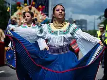 Image 14A woman in Ecuadorian dress participating in the 2010 Carnaval del Pueblo. (from Culture of Ecuador)