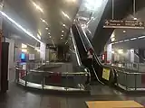 Escalators that lead to the platform.