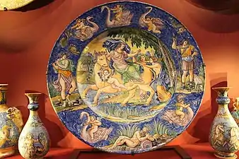 Nevers faience; central dish is 58&nbsp;cm across, the main scene is the Rape of Europa, after an illustration of Ovid by François Chauveau, published in 1674