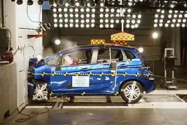 2016 Honda Fit striking a wall head-on at 56&nbsp;km/h.