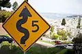 Traffic caution sign at top of switchbacks recommends a top speed of 5 miles per hour (8.0&nbsp;km/h)