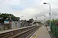 A broad view of the platforms and footbridge.