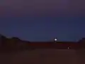 Moonrise above the 12&nbsp;meter wide access road to the ALMA High Site.