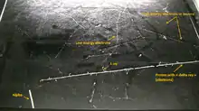 Image taken in the Pic du Midi at 2877&nbsp;m in a Phywe PJ45 cloud chamber (size of surface is 45 × 45 cm). This rare picture shows in a single shot the 4 particles that are detectable in a cloud chamber : proton, electron, muon (probably) and alpha
