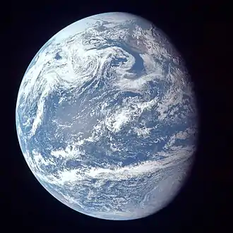 Image 63A view of Earth with its global ocean and cloud cover, which dominate Earth's surface and hydrosphere. At Earth's polar regions, its hydrosphere forms larger areas of ice cover (from Earth)
