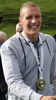 Image 10Pál Joensen after coming back home to his hometown Vágur after winning a silver medal at the 2010 European Aquatics Championships (from Culture of the Faroe Islands)