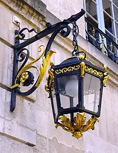 Carved and glided lantern on the street facade