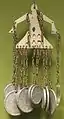 A pendant made of Japanese coins, brass, aluminum and glass