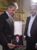 The recreated great Golden Fleece of King Louis XV of France, presented by H. Horovitz (left) and François Farges&nbsp;[fr] (right) at the Hôtel de la Marine, formerly the royal Storehouse in Paris, on June 30, 2010