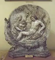Baroque relief of Saint Irene curing Saint Sebastian's injuries.