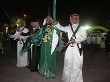 Image 5Saudi males dressed and prepared for ardah, the national dance. It also includes swords, poetry, and singing. (from Culture of Saudi Arabia)
