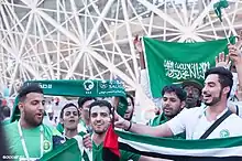 Image 18Saudi football fans cheering for their national football team at the FIFA World Cup (from Culture of Saudi Arabia)